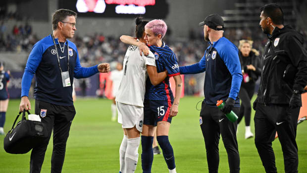 Nov 11, 2023; San Diego, California, USA; OL Reign forward Megan Rapinoe (15) hugs New Jersey/New York Gotham FC defender Ali Krieger (11) as she exits the game following an apparent injury during the first half in the 2023 NWSL Championship match at Snapdragon Stadium.